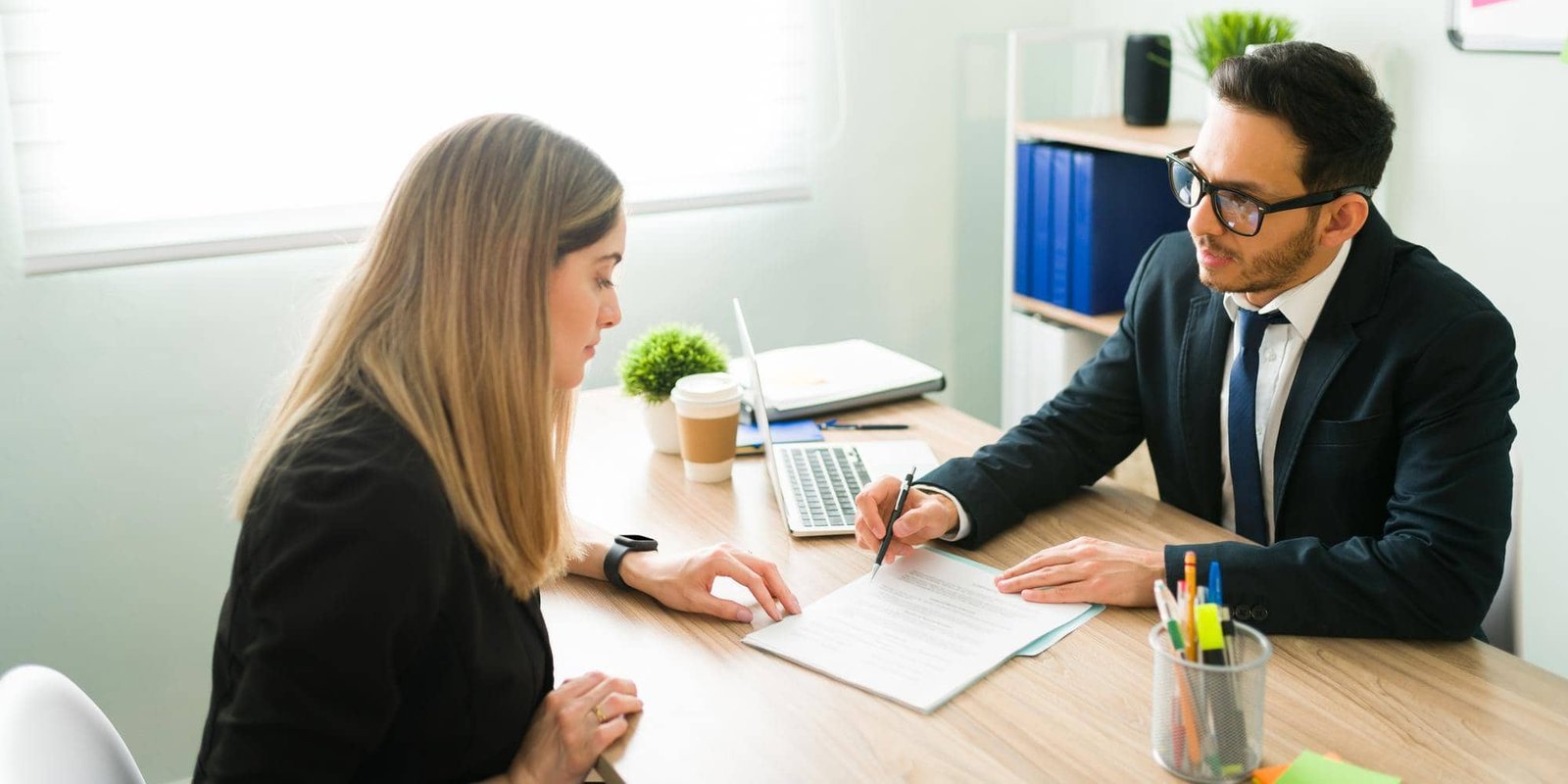 Consultant reviewing hiring documents with a candidate