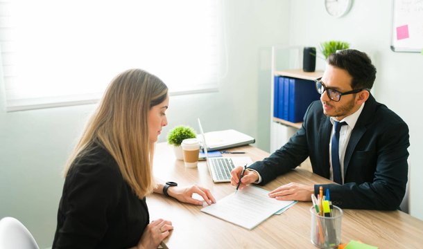 Consultant reviewing hiring documents with a candidate