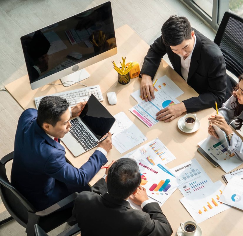 Talent strategy team reviewing workforce data in a modern office